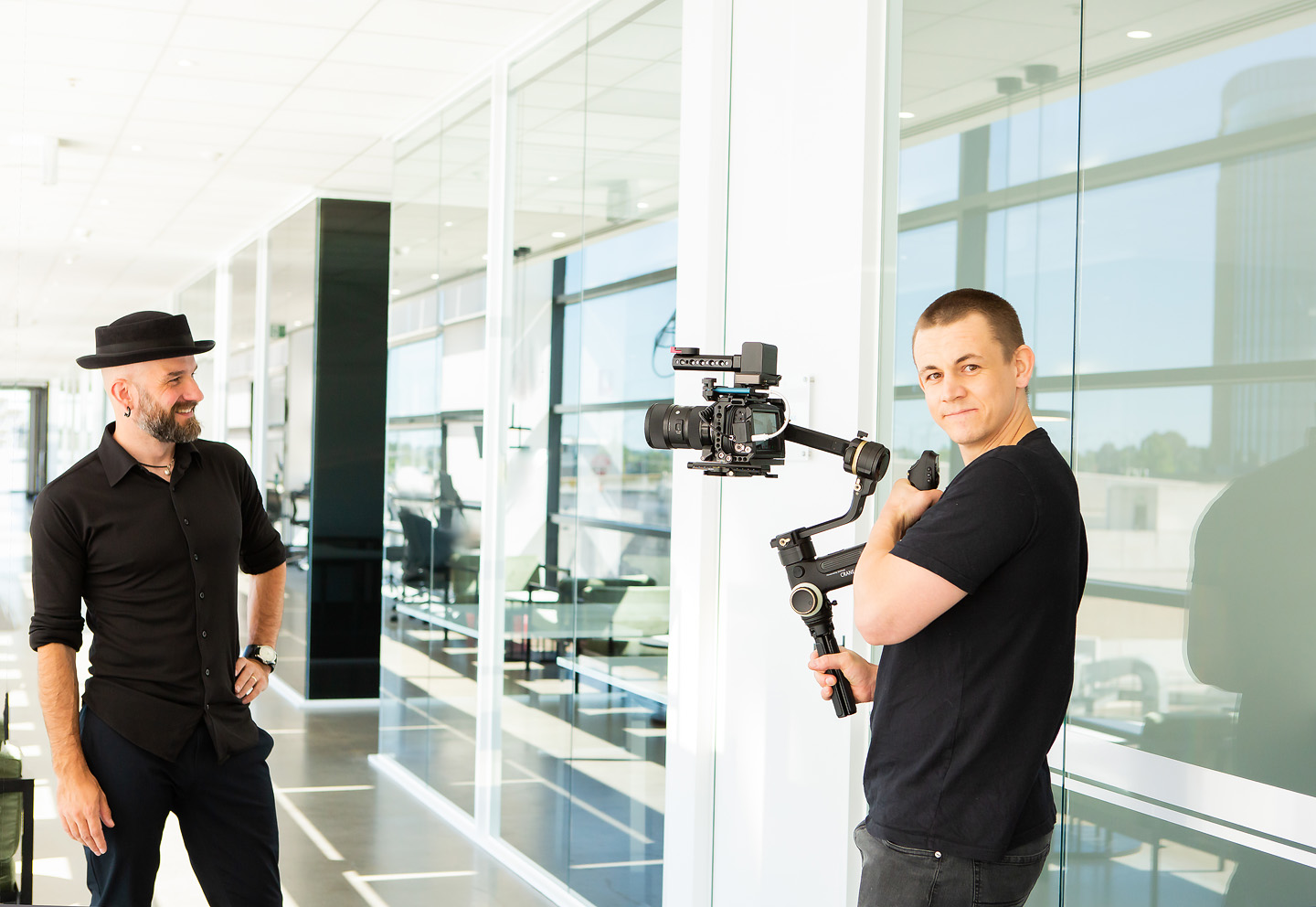 Arek and a camera operator on location with a gimbal stabiliser