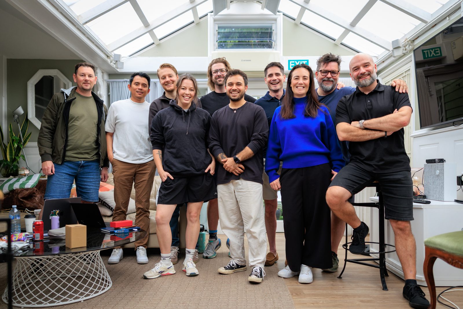 The full group standing together in the conservatory at the end of the two days